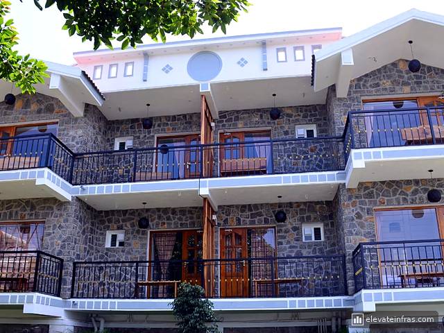 Close-up of the stone walls, balconies and timber doors